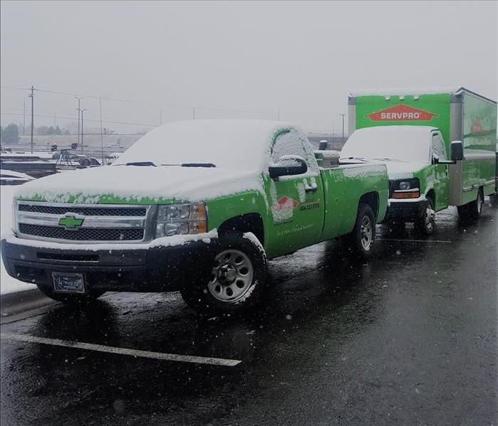 SERVPRO company trucks being snowed on. 